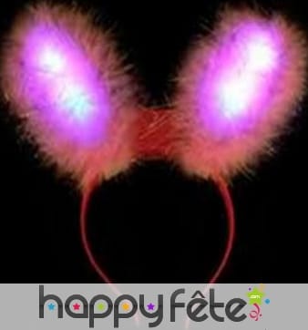 Oreilles de lapin rose lumineuses sur serre tête