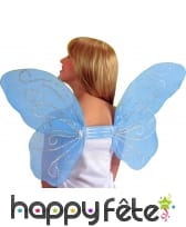 Ailes de papillon bleues avec paillettes