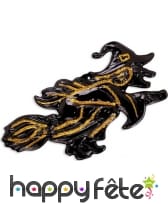 Sorcière noire et dorée sur son balais 58cm