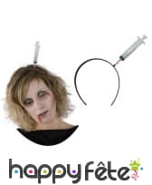 Serre-tête seringue plantée dans le crâne